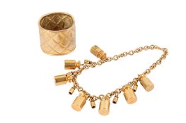 A gilt metal necklace and cuff bangle.