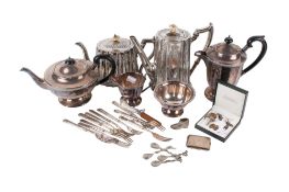 A small group of silverplated items.