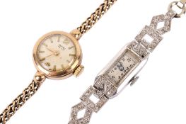 A vintage 9ct gold lady's dress watch and a white metal example.