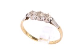An 18ct three stone diamond ring. The central stone circa 2.