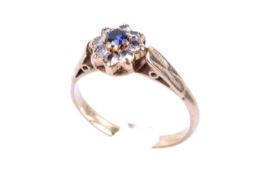 A 9ct gold small cluster ring.