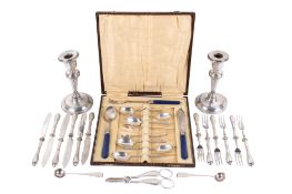 A group of silver and silverplated table items.
