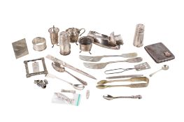 A small group of silver and white metal items.