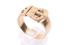 A 9ct gold buckle ring. Of wide, pierced design, hallmarked, size R, weight 6.4g.