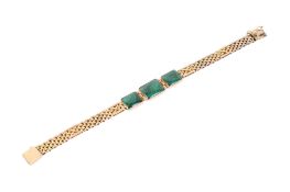 A 15ct gold and malachite bracelet. The three flat rectangular stone panels measuring 1.3cm x 1.