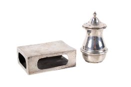 A silver matchbox cover and a pepper pot.
