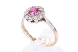 A 9ct gold white and red stone cluster ring.