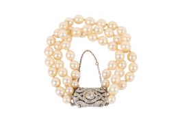 A vintage faux pearl three-string bracelet.