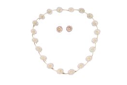 A silver gilt daisy necklace and matching earrings.