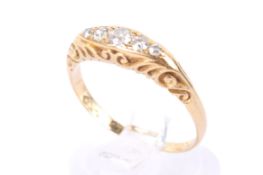 An 18ct gold and five stone diamond ring.