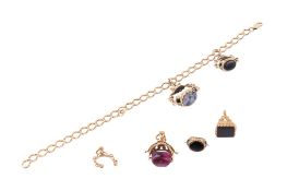 Five yellow metal stone set fobs and a 9ct gold chain.