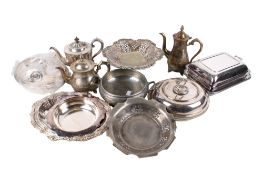 A collection of assorted silver plate items. Including entree dishes, fruit tazza, teapots, etc.
