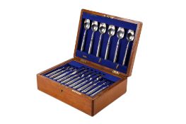 An Edwardian silver and mother of pearl canteen of dessert cutlery.