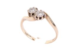 A 9ct gold and diamond crossover ring.