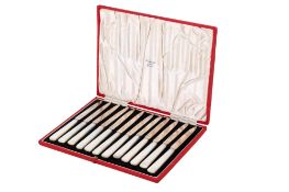 A boxed set of twelve silver and mother of pearl fruit knives.