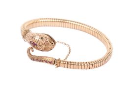 A 9ct gold snake bangle.