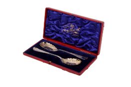 A pair of silver compote spoons.