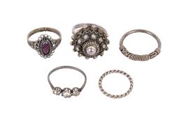 Five white metal rings. Two set with stones, etc, gross weight 13.4g.