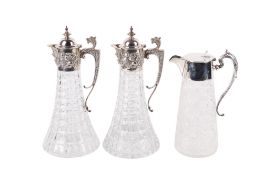 Three silver mounted cut glass claret jugs.