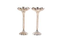 A pair of early 20th century slender weighted silver trumpet vases.