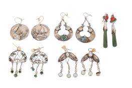 Five pairs of floral design white metal and stone pendant earrings.