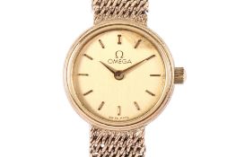 A 9ct gold lady's Omega wristwatch. With gilt markers to the round gold face, case diameter 1.