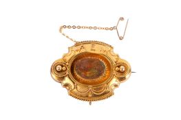 A 19th century yellow metal mourning brooch.