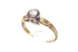 An 18ct gold and platinum ring with loose white stone.