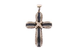 An 18ct white gold and sapphire and diamond cross.