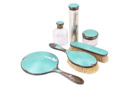 A silver and turquoise enamel dressing table set.