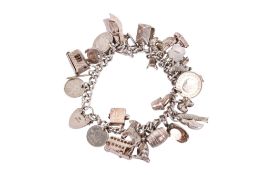 A silver charm bracelet with charms.