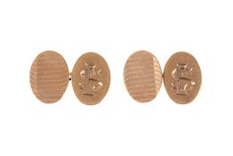 A pair of 9ct gold cufflinks. Engraved with the initials ES, hallmarked, gross weight 5.4g.