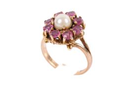 A 9ct gold, garnet and pearl cluster ring.