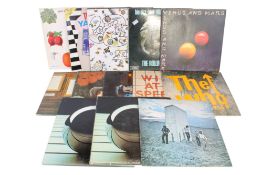 A collection of thirteen 1960s & 70s LP vinyl record rock albums.
