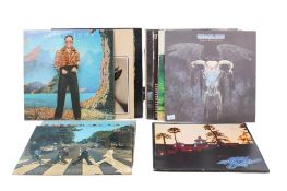 A group of thirteen assorted 1960s, 70s and 1980s LP vinyl records.