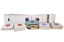 A collection of assorted 7 inch 45 rpm vinyl single records.