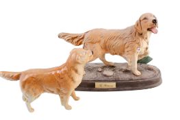 Two Beswick Pottery golden retriever dog figures.