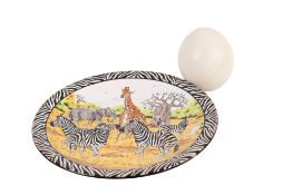 A handpainted African plate and an ostrich egg.