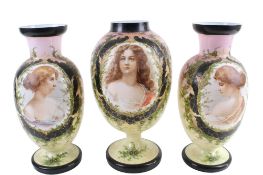Three Victorian transfer printed and painted glass vases.