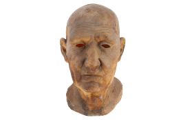 A mixed media realistic model head of an elderly gentleman.