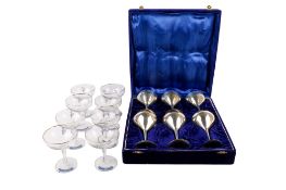 A cased set of six EPNS goblets and eight Babycham glasses. Max.