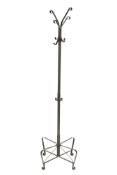 A retro metal coat stand. Raised on four shaped supports with scroll feet.