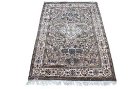 A small brown and grey ground rug.