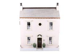 A 20th century doll's house and contents.