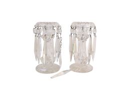 A pair of early 20th century glass candlestick lustres. Raised on a circular base.