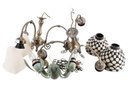 A pair of ceiling lights and shades and a wall light.