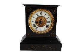 An early 20th century cast metal mantle clock.