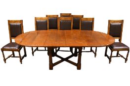 A contemporary oak dining table and set of eight chairs.