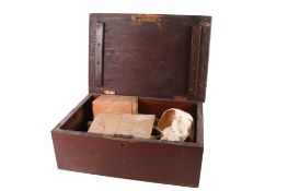 A large wooden box and contents.