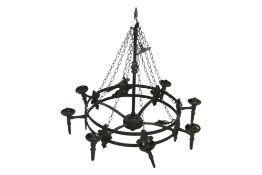 A large cast metal chandelier. Of circular form with eight light fittings.